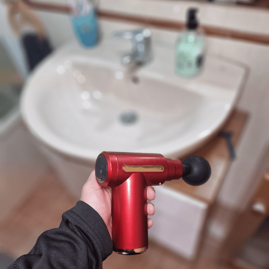 Pistola de masajes portatil